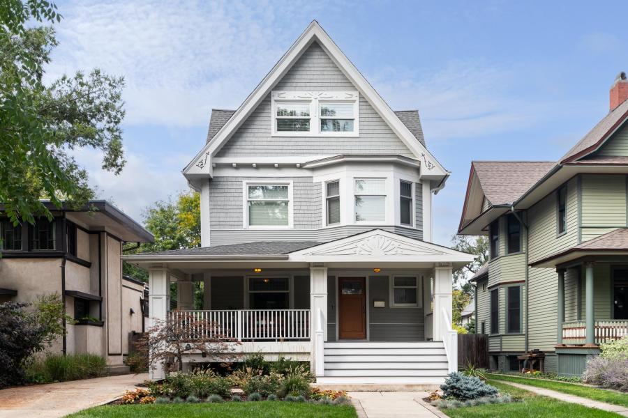A grey and white Victorian home exterior